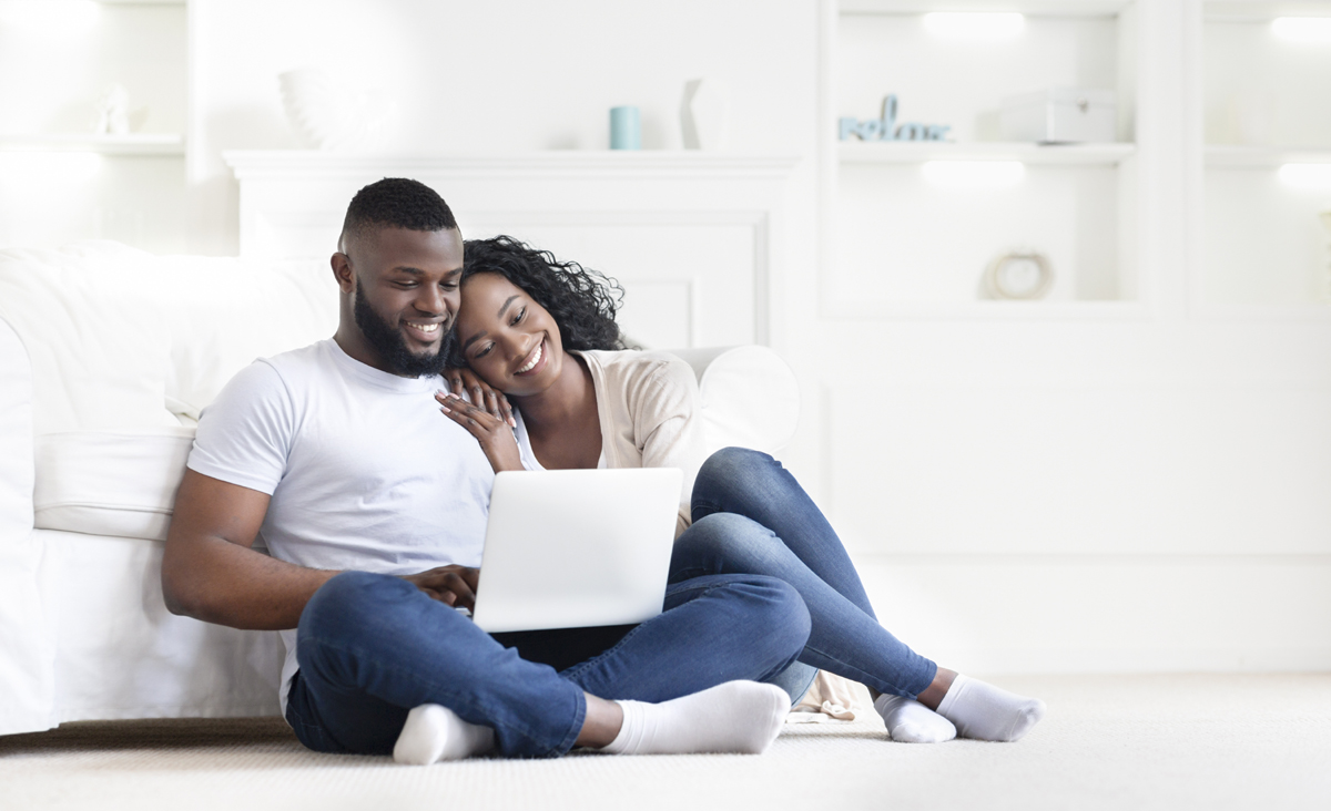 African American couple researching mortgages